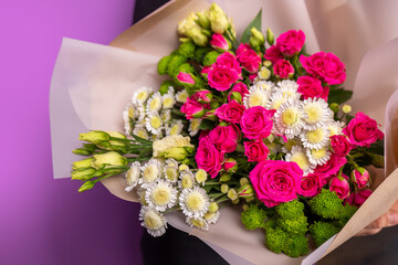 The girl with big bouquet of beautiful flowers