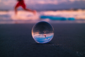 glass sphere on the beach