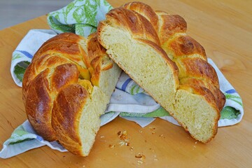 A braided challah brioche bread shaped as a heart cut in half