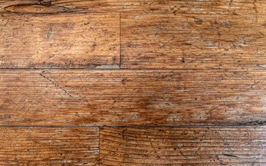 weathered natural wooden planks pattern closeup, brown background