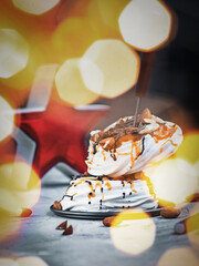 Meringue with chocolate, caramel filling and nuts. Sweet dessert. 