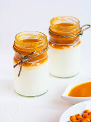 yogurt or cottage cheese with homemade sea buckthorn jam. Healthy breakfast. Low-calorie food.