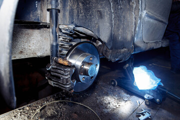 new brake disc on the wheel hub, brake system repair