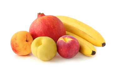 Fototapeta na wymiar Pomegranate, bananas and peaches isolated on white