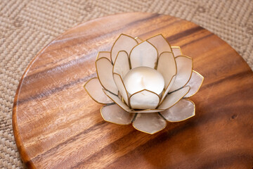 candle holder made of metal and glass as a lotus flower - obrazy, fototapety, plakaty