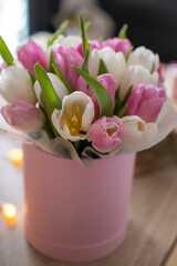 bouquet of pink and white tulips in a rose box