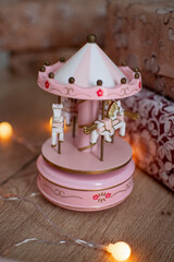 decorative toy musical carousel with pink and whight horses