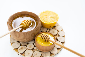 honey and lemon on white - alternative medicine