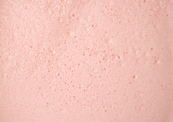 Pink foam. Pastel background with copy space. Flat lay