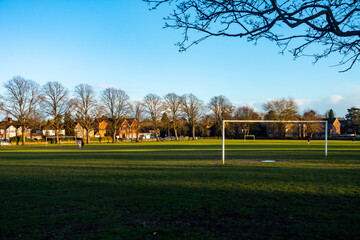 Goal posts in an empty Prospect Park in Reading, UK on a quiet, empty winter's day in late afternoon in February 2021.