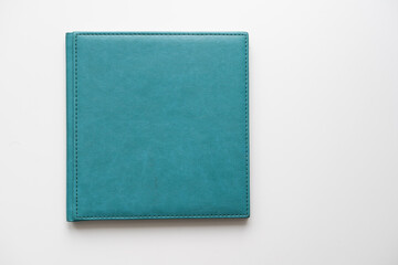 The book with a white cover on white background