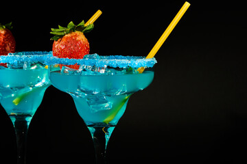 A martini cocktail on the rocks on a black background