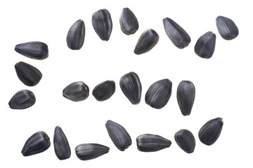 Close-up of sunflower black seeds, isolated on white background.