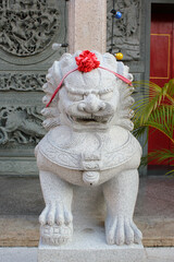 Stone lion statue in chinese temple.
