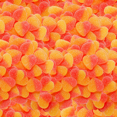 Seamless background from gummy hearts. Design option for packaging goods. - 415264759