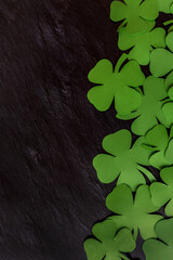 Happy St. Patrick's Day. clover leaves on a dark background