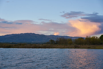 Lake view at sunset with Gardunha mountains on the background at sunset in Castelo Branco, Portugal