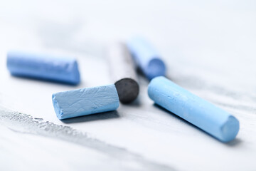 Soft pastels on bright wooden background. Close up.	