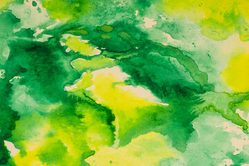 A green and yellow abstract water color painting.
