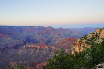 Golden Sunset at Grand Canyon Arizona. Blue smoky haze accentuates the canyon