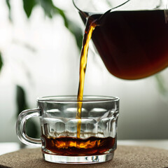 pouring tea into glass