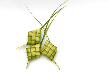 Fototapeta na wymiar Ketupat (Rice Dumpling) On white Background. Ketupat is a natural rice casing made from young coconut leaves for cooking rice during eid Mubarak, Eid ul Fitr