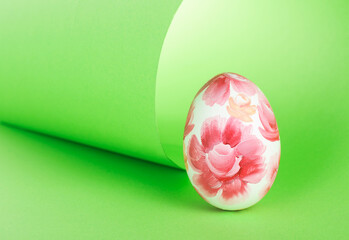 Easter Egg with pink floral pattern on green background