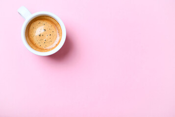Obraz na płótnie Canvas Cup of coffee on bright background. Top view.