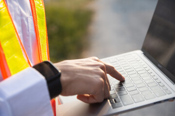 Worker Engineer work outdoor by computer laptop technology
