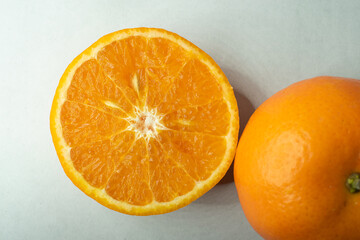 Slices of orange or tangerine isolated on white background. Flat lay, top view. Fruit composition
