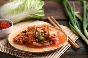 Kimchi cabbage on wooden plate with ingredients, Homemade Korean food