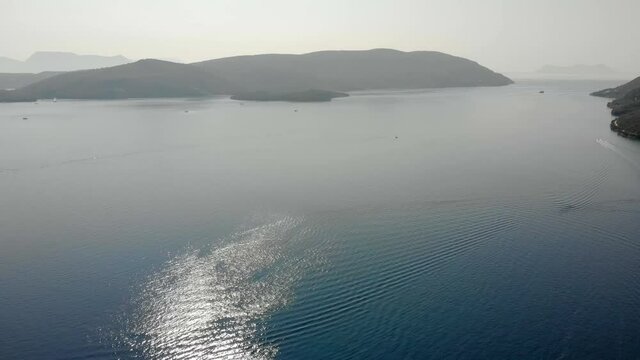 Desimi Beach Golf and nearby Island with clear water in Greece. Aerial