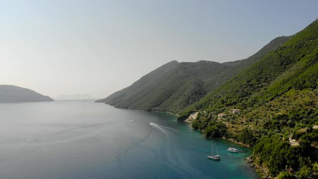 Desimi Beach Golf and nearby Island with clear water in Greece. Aerial