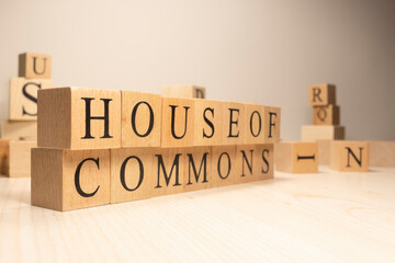 House of commons word from wooden cubes. Terms of economy state government.