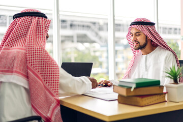 Successful of two arab business people working with laptop computer.creative arabic people planning and brainstorm in modern office.Teamwork concept