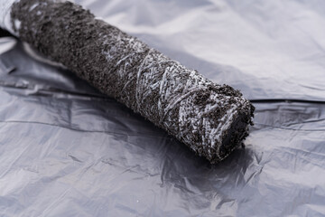 Tube wrapped with polypropylene thread to be installed in a carbon-filled cartridge to hold filter...