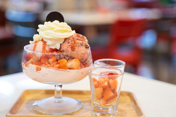 Strawberry ice cream served in a glass ceramic bowl