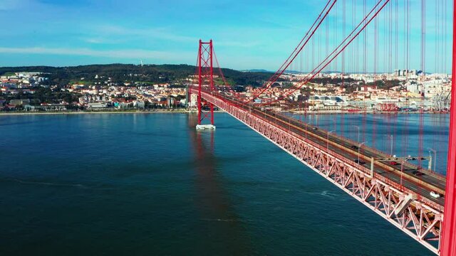 Aerial view of red 25 De April Bridge in Lisbon, Potugal. Bridge connecting Lisbon and Almada