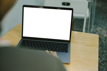 computer screen blank mockup.hand woman work using laptop with white background for advertising,contact business search information on desk at coffee shop.marketing and creative design