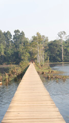 wooden bridge over the river