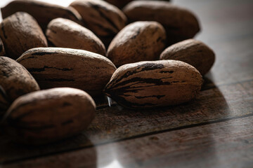 Pecan Nuts In Shell On Wood Table