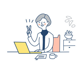 ピースサインをしているリモートワーク中の中高年女性