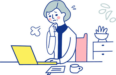 困っている表情のリモートワーク中の中高年女性