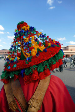 Traditional Water Seller In Red Uniform