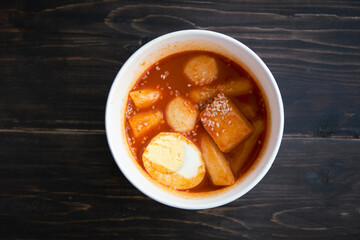 Stir-fried Rice Cake Tteok-bokki in a takeaway container. Korean food delivery.