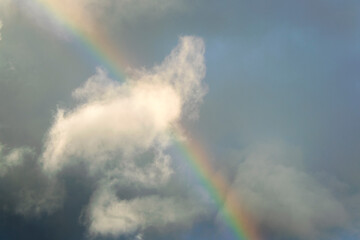 Fototapeta na wymiar Rainbow in rural area of Guatemala, rain and mountains in open space, natural phenomenon.