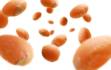 Red lentils levitate on a white background