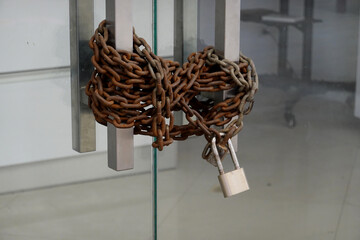 The glass door was locked with padlocks and old chains. 
Concept go out of business.   