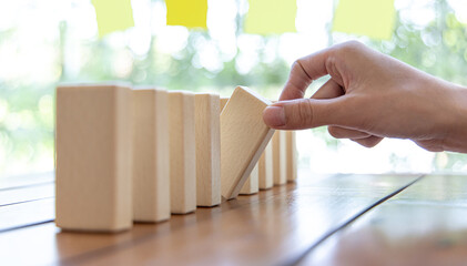 Strategies and risks of wooden games, Close-up of business people gambling with investment risk,...