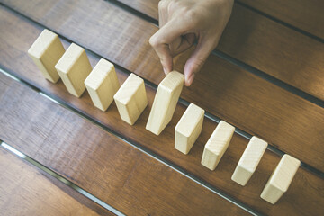Strategies and risks of wooden games, Close-up of business people gambling with investment risk,...